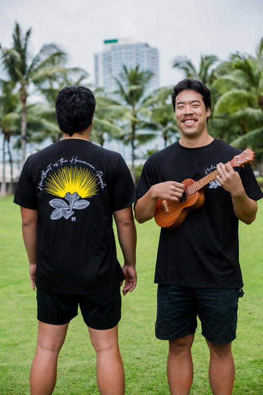 Translation missing: en.Hula is Life Lehua Mamo T-shirt featuring a colorful Hawaiian floral design on a casual cotton T-shirt