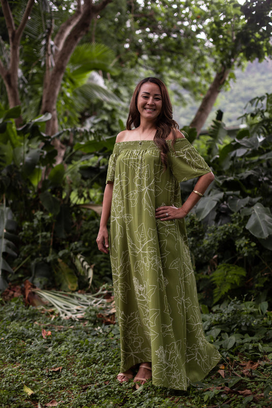 Translation missing: en.Kukui Olive Hiehie Dress by Hula is Life featuring a flowy, lightweight fabric with a tropical print and adjustable straps