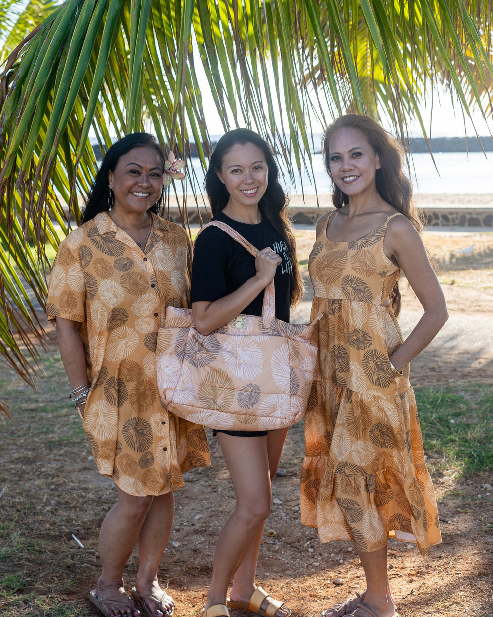 ʻOpihi ʻEke Mākaukau bag with the ʻOpihi Mālie and Mehana Dresses
